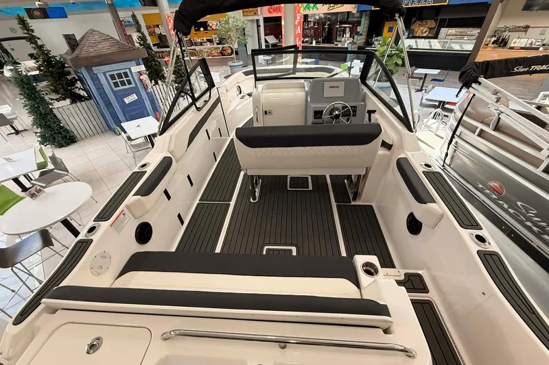 Slide: The Image of 2026 Bayliner Trophy T22SC boat interior with sleek seating and modern dashboard. - 3