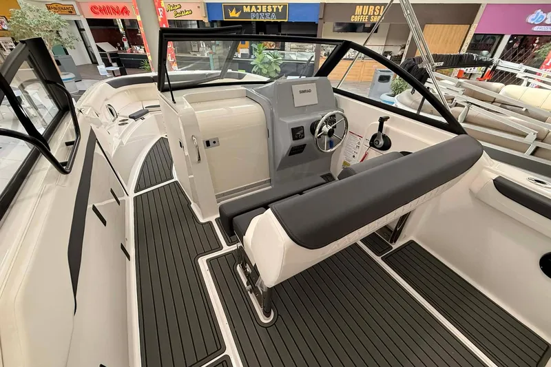 Slide: The Image of 2026 Bayliner Trophy T22SC boat interior with sleek design and modern dashboard. - 7