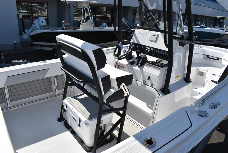 Slide: The Image of 2025 Blackfin 222CC boat interior with console, seating, and steering wheel. - 9