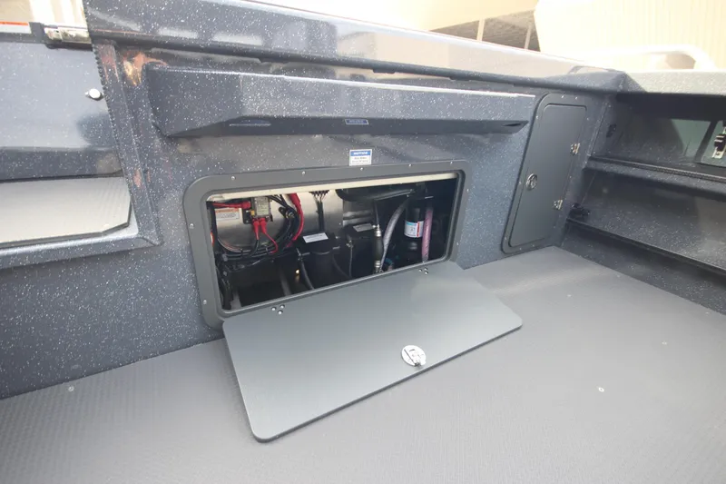 Slide: The Image of 2026 Weldcraft 260 Ocean King interior with blue lighting and multiple rod holders. - 15