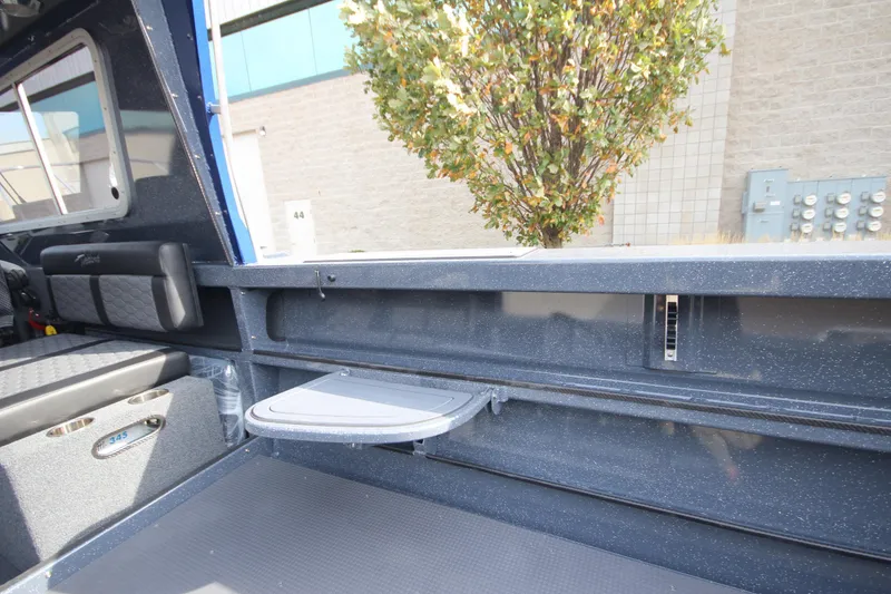 Slide: The Image of Interior of 2026 Weldcraft 260 Ocean King boat, featuring modern seating and navigation controls. - 19