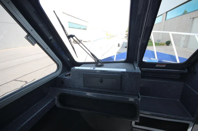 Slide: The Image of 2026 Weldcraft 260 Ocean King boat deck, featuring sleek design and logo. - 25