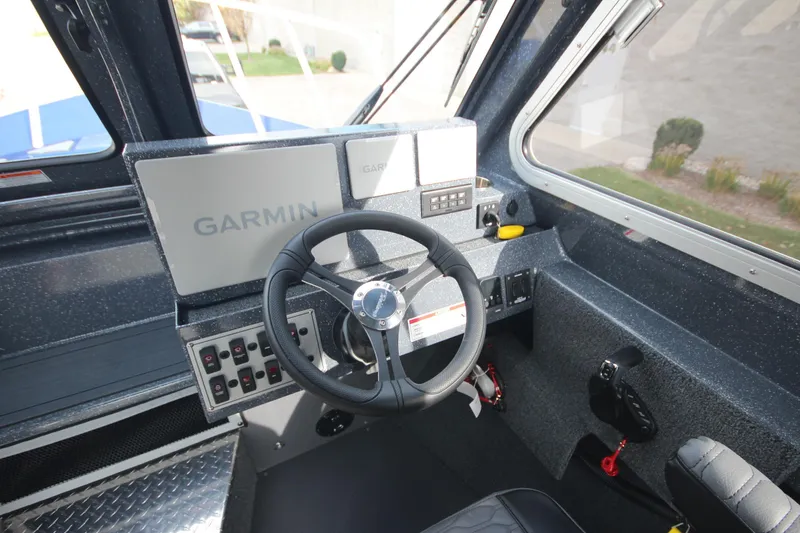 Slide: The Image of 2026 Weldcraft 260 Ocean King boat, blue exterior, front view at a showroom. - 27