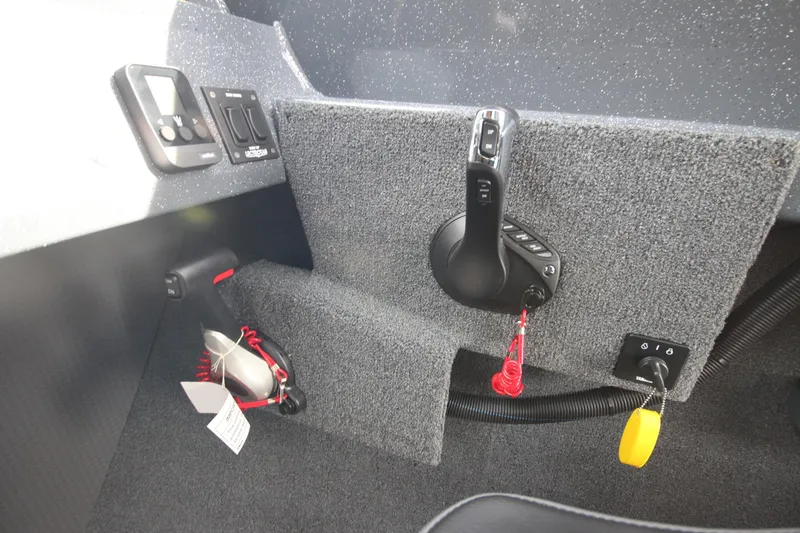 Slide: The Image of 2026 Weldcraft 260 Ocean King boat with open storage compartment, blue exterior. - 28