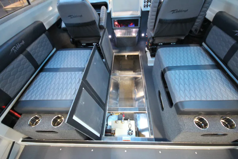 Slide: The Image of Interior of 2026 Weldcraft 260 Ocean King boat, featuring seating and storage compartments. - 34