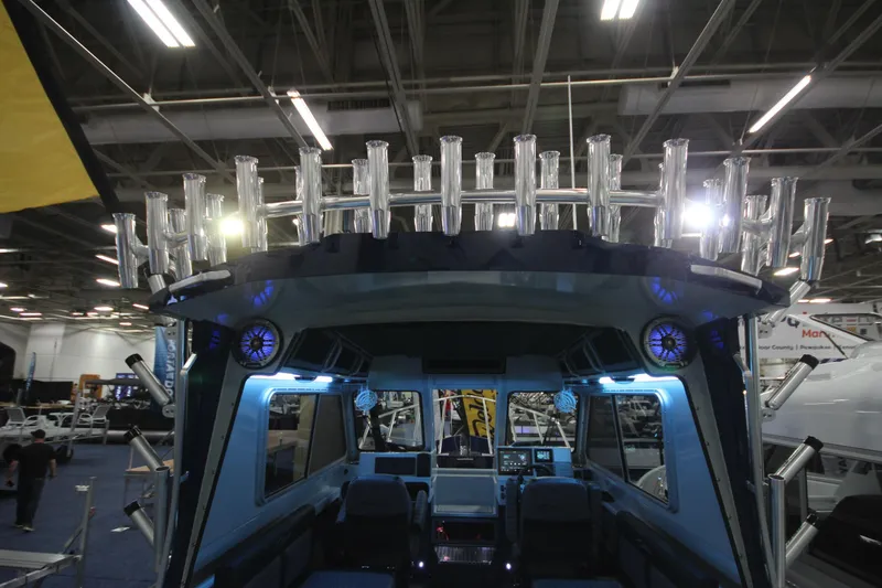 Slide: The Image of 2026 Weldcraft 260 Ocean King boat interior with rod holders and modern controls. - 36