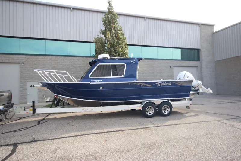 The Image of 2026 Weldcraft 260 Ocean King "Great Lakes Edition" boat displayed indoors. - 2