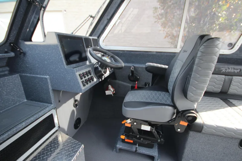 Slide: The Image of 2026 Weldcraft 260 Ocean King boat at indoor exhibition, featuring Garmin equipment. - 26