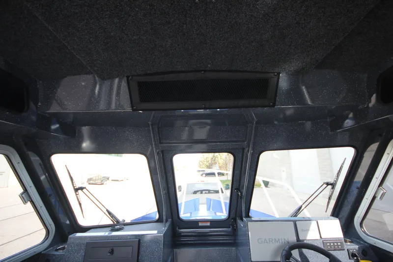 Slide: The Image of Interior of 2026 Weldcraft 260 Ocean King boat, featuring modern seating and spacious layout. - 29