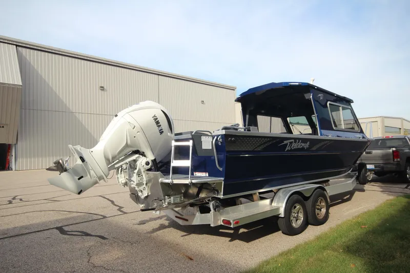Slide: The Image of 2026 Weldcraft 260 Ocean King "Great Lakes Edition" F350XSB boat on display indoors. - 6