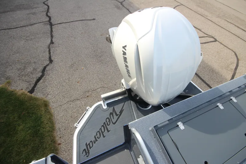 Slide: The Image of 2026 Weldcraft 260 Ocean King boat with Yamaha outboard motors displayed indoors. - 9