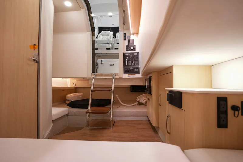 Slide: The Image of Interior of 2025 Regal 33 SAV boat, featuring modern design and compact living space. - 23