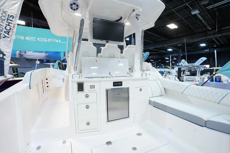 Slide: The Image of 2025 Regal 33 SAV boat interior with seating and control panel. - 5
