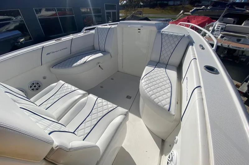Slide: The Image of 2017 Midnight Express 39S Cuddy boat interior with white quilted seating. - 17