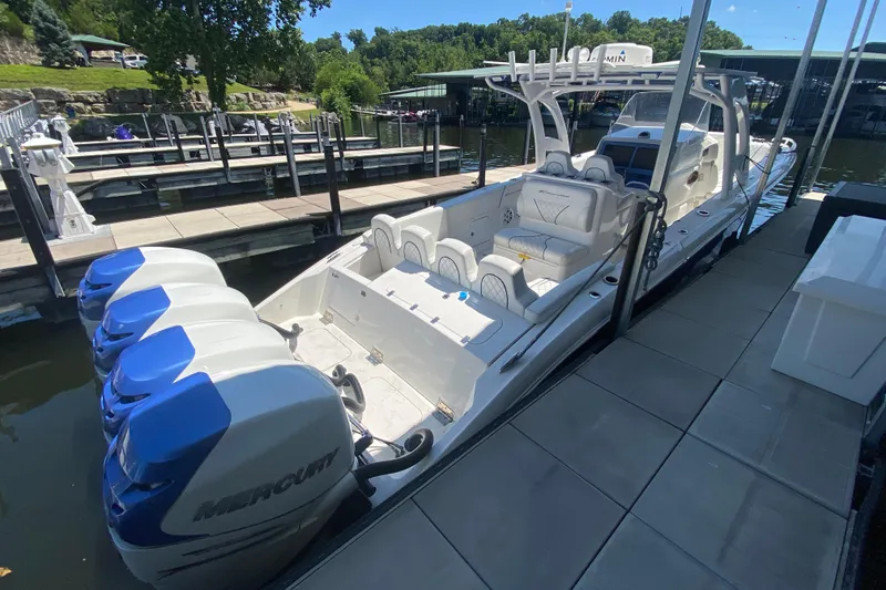 Slide: The Image of 2017 Midnight Express 39S Cuddy boat docked, featuring multiple Mercury outboard engines. - 28