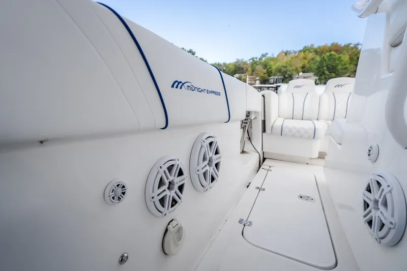 Slide: The Image of 2017 Midnight Express 39S Cuddy interior with white seating and audio speakers. - 35