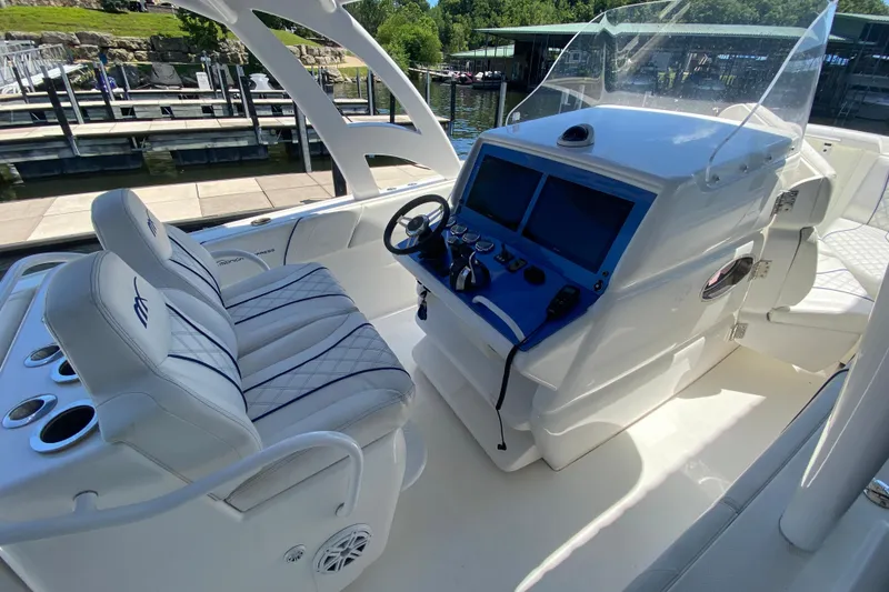 Slide: The Image of 2017 Midnight Express 39S Cuddy boat interior with helm and seating. - 31