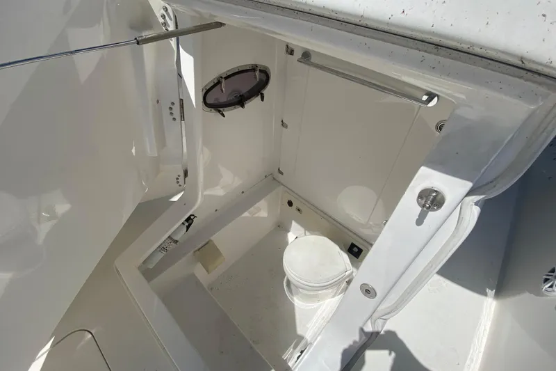 Slide: The Image of 2017 Midnight Express 39S Cuddy boat interior with compact marine toilet. - 33