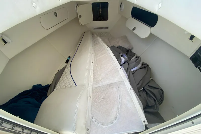 Slide: The Image of 2017 Midnight Express 39S Cuddy interior with white upholstery and storage compartments. - 34