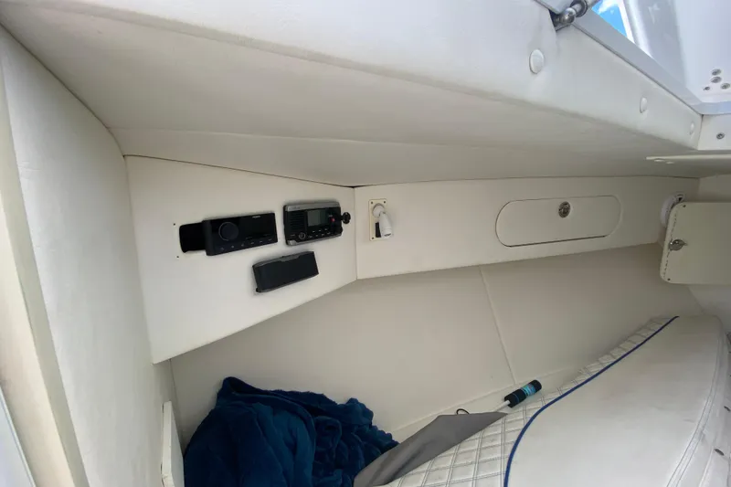 Slide: The Image of Interior cabin of 2017 Midnight Express 39S Cuddy with radio equipment and bedding. - 35