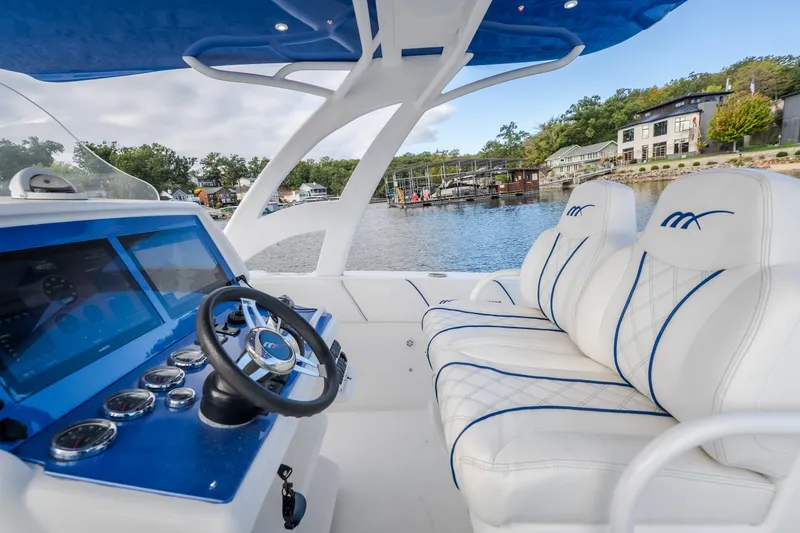 Slide: The Image of Interior of 2017 Midnight Express 39S Cuddy boat with modern dashboard and plush seating. - 28