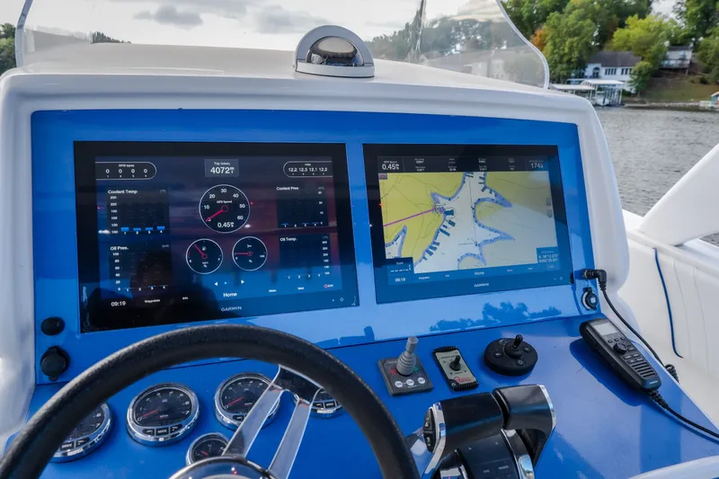Slide: The Image of Dashboard of a 2017 Midnight Express 39S Cuddy boat with navigation screens. - 29