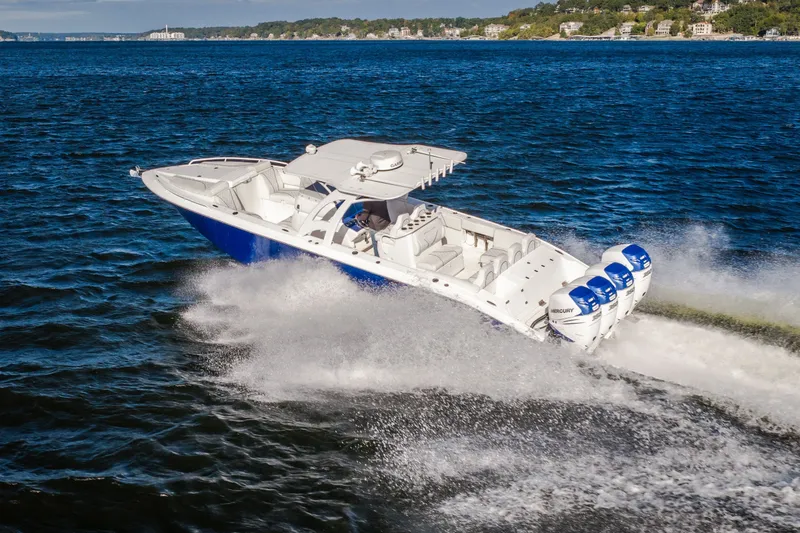 Slide: The Image of 2017 Midnight Express 39S Cuddy boat cruising on open water with powerful engines. - 7