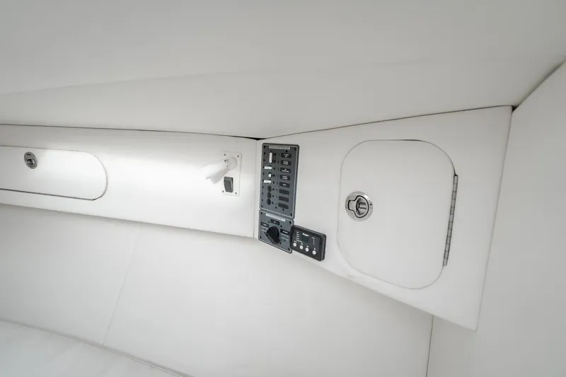 Slide: The Image of Interior view of 2017 Midnight Express 39S Cuddy boat, featuring control panel and storage compartments. - 44