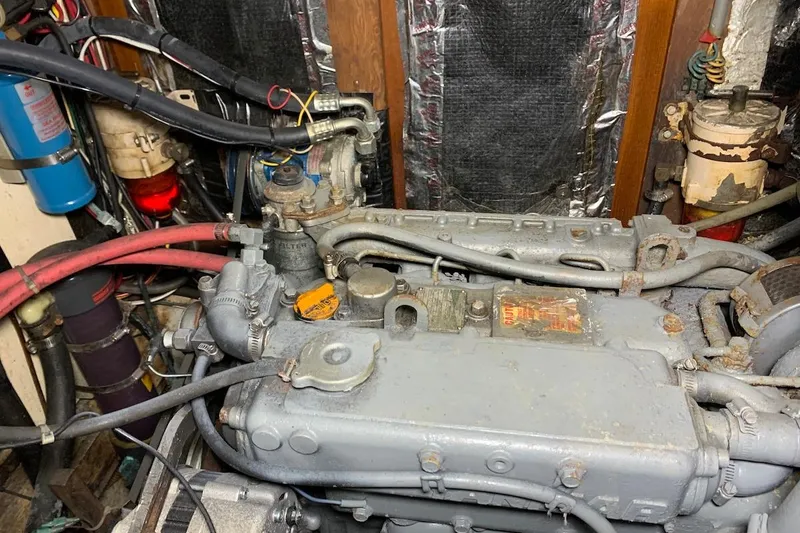 Slide: The Image of Engine compartment of a 1981 Hardin 45 boat, showing detailed mechanical components. - 18