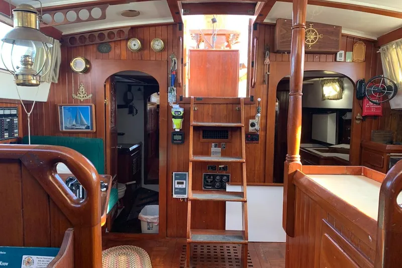 Slide: The Image of Interior of a 1981 Hardin 45 sailboat with wooden paneling and nautical decor. - 20