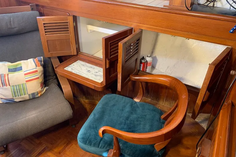 Slide: The Image of Interior of 1981 Hardin 45 yacht with wooden cabinetry and seating area. - 27