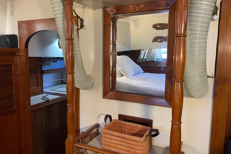 Slide: The Image of Interior of a 1981 Hardin 45 yacht with wooden accents and a cozy bedroom. - 33