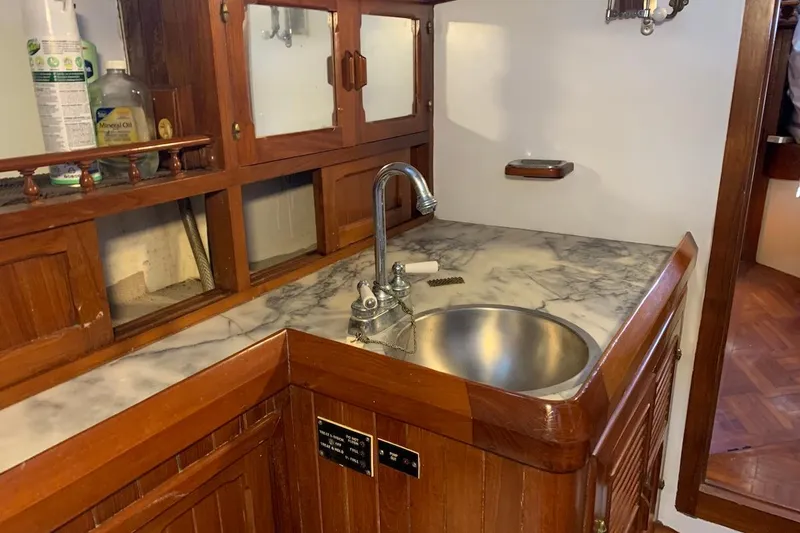 Slide: The Image of Wooden boat galley with marble countertop and sink, Hardin 45, 1981 model. - 35