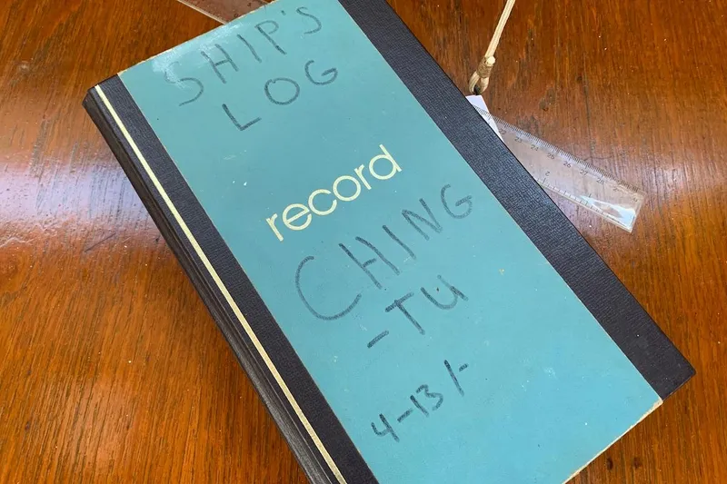 Slide: The Image of Ship's logbook titled "Record" on wooden surface, Hardin 45, 1981. - 37