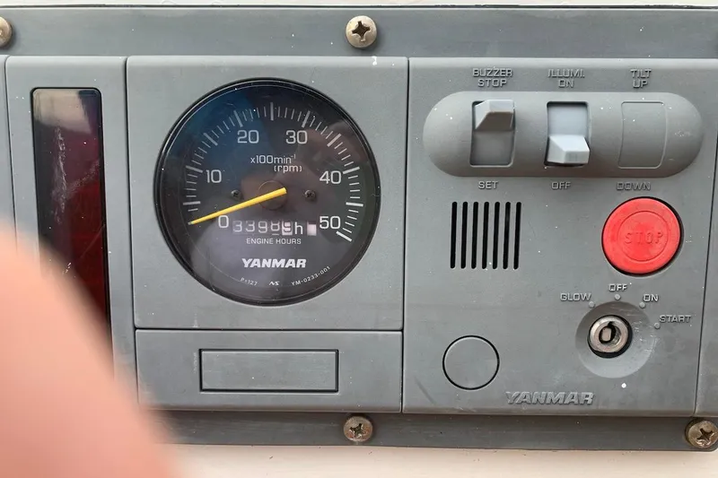 Slide: The Image of Yanmar engine control panel with RPM gauge and controls, Hardin 45, 1981 model. - 42