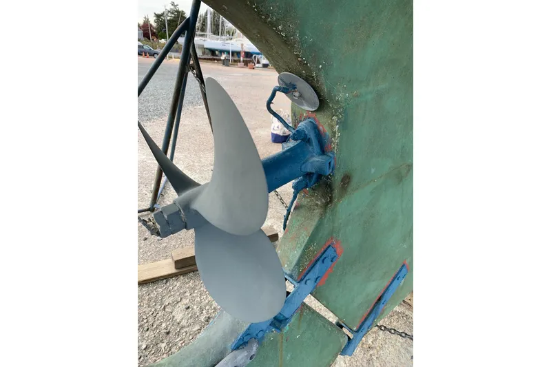 Slide: The Image of Propeller of a 1981 Hardin 45 sailboat on dry dock, showing detailed rudder mechanism. - 48