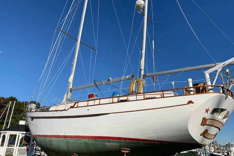 Slide: The Image of 1981 Hardin 45 sailboat docked under clear blue sky. - 52