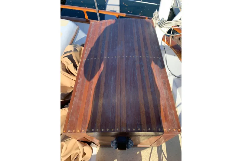 Slide: The Image of Wooden deck of a 1981 Hardin 45 sailboat, featuring polished planks and nautical details. - 9