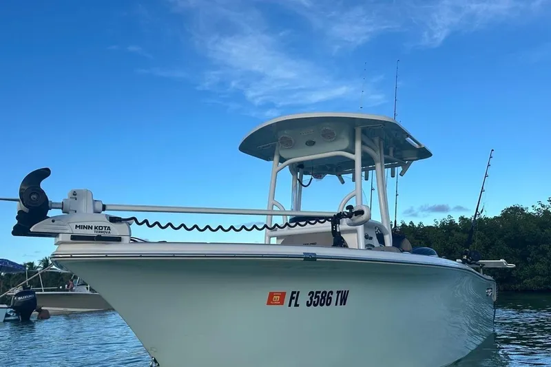 The Image of 2024 Sea Pro 222 Center Console boat with Minn Kota Terrova motor on calm water. - 1