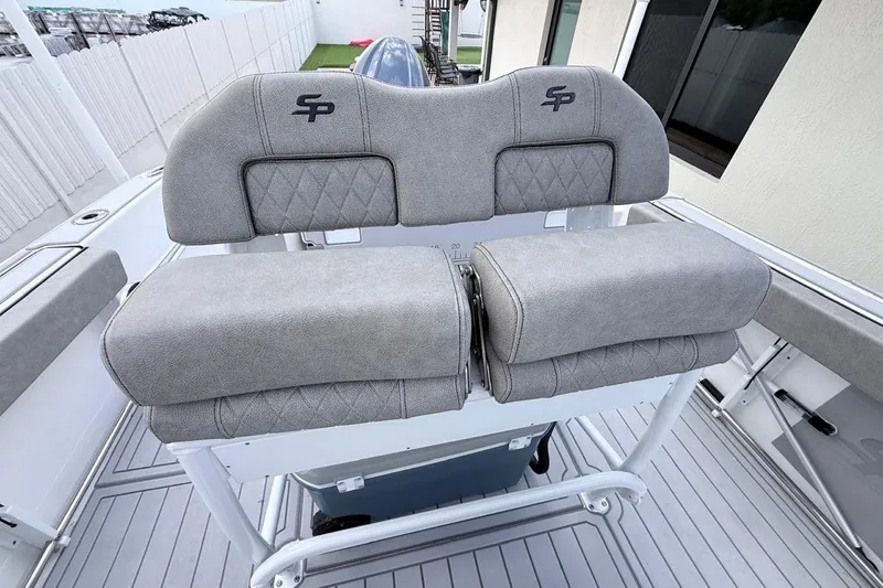 Slide: The Image of 2024 Sea Pro 222 Center Console boat with cushioned seating and sleek design. - 10