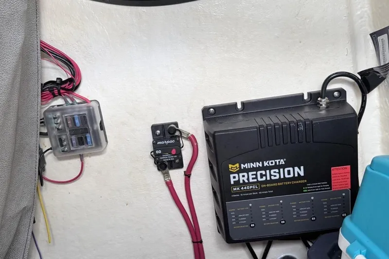 Slide: The Image of 2024 Sea Pro 222 Center Console with Minn Kota Precision battery charger setup. - 14