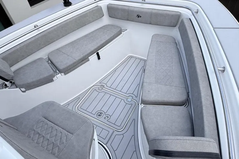Slide: The Image of 2024 Sea Pro 222 Center Console boat interior with cushioned seating and non-slip flooring. - 15