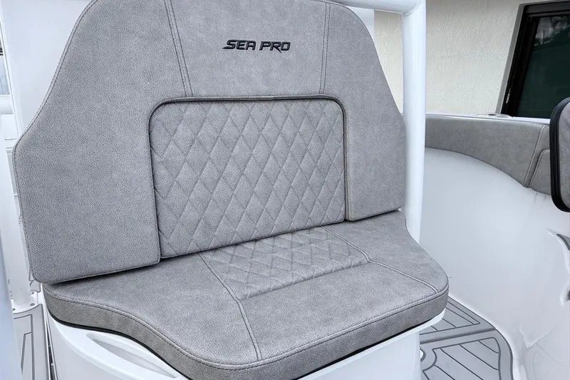 Slide: The Image of 2024 Sea Pro 222 Center Console boat seat with gray diamond-pattern upholstery. - 16