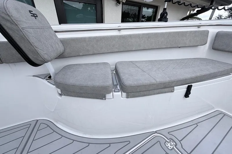 Slide: The Image of 2024 Sea Pro 222 Center Console boat interior with gray cushioned seating. - 17