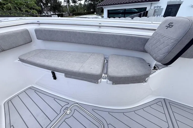 Slide: The Image of 2024 Sea Pro 222 Center Console boat interior with gray cushioned seating. - 18