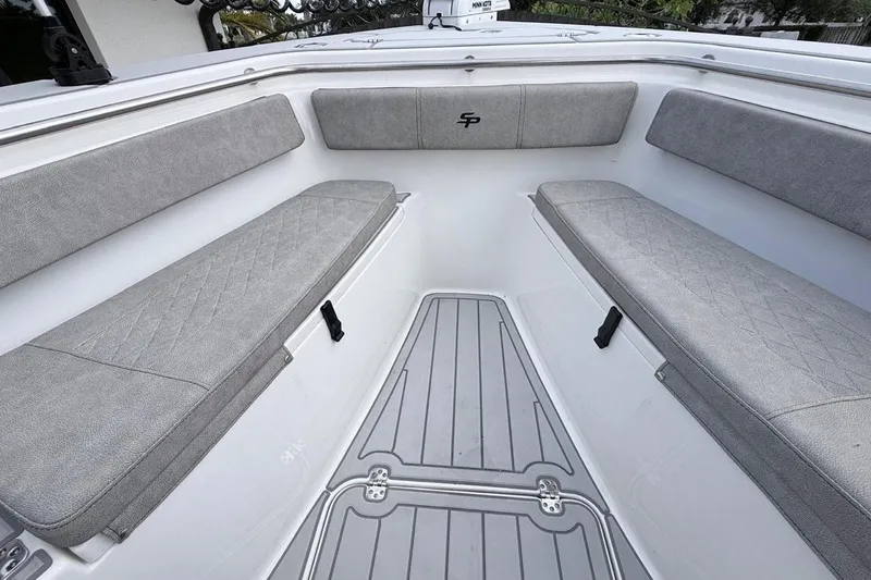 Slide: The Image of 2024 Sea Pro 222 Center Console boat interior with gray cushioned seating and sleek flooring. - 20