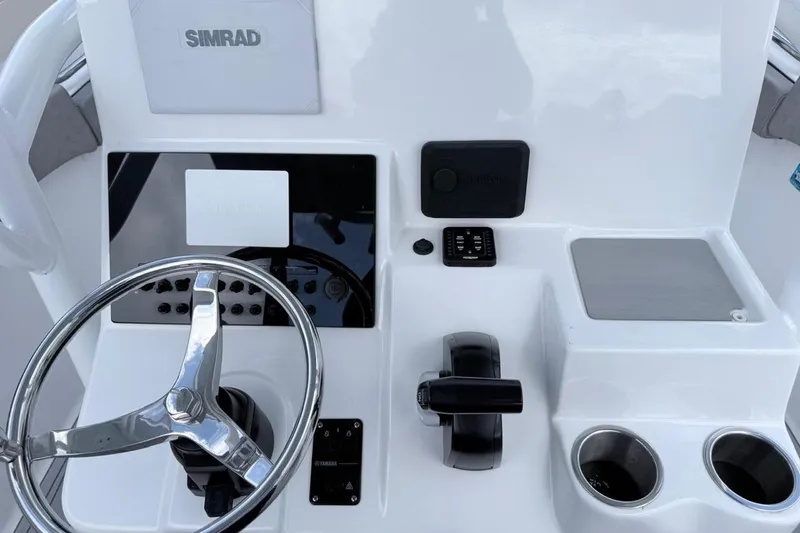 Slide: The Image of 2024 Sea Pro 222 Center Console dashboard with steering wheel and controls. - 4