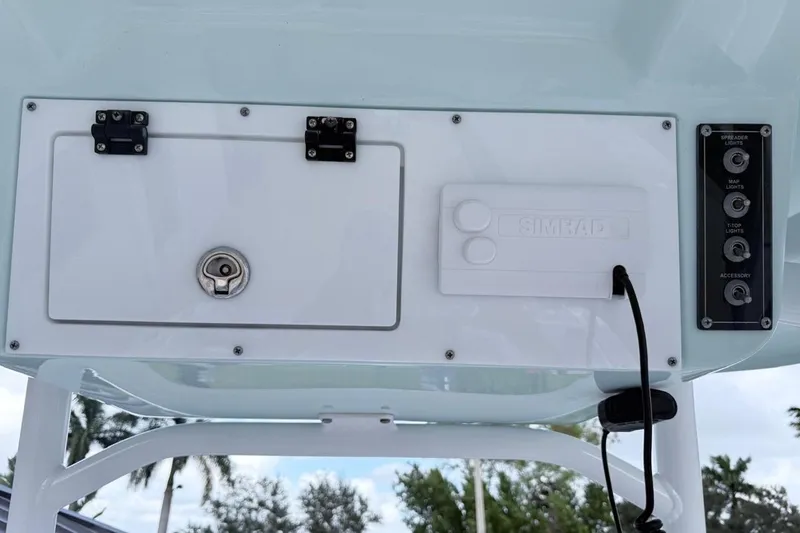 Slide: The Image of 2024 Sea Pro 222 Center Console boat dashboard with control panel and storage compartment. - 7
