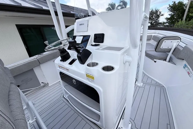 Slide: The Image of 2024 Sea Pro 222 Center Console boat interior with modern helm and seating. - 9