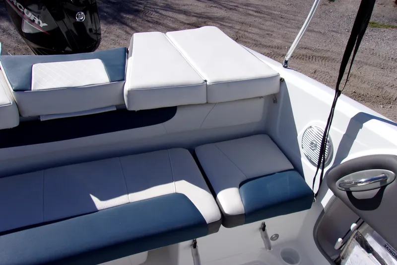 Slide: The Image of 2021 Tahoe 550 TF boat interior with cushioned seating and speaker. - 10